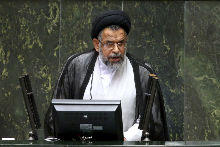 Iranian Intelligence Minister Mahmoud Alavi answers questions from lawmakers in an open session of parliament in Tehran, Iran, Tuesday, Oct. 25, 2016. Iran's intelligence minister is defending his agents' handling of a visit by a gay Utah state senator after hard-liners alleged it represented a security breach. Alavi said Sen. Jim Dabakis was under "full surveillance" during his six-day visit in September. Alavi also questioned why hard-liners didn't have a problem with Dabakis making a 15-day visit in 2010 during the administration of hard-line President Mahmoud Ahmadinejad. (AP Photo/Ebrahim Noroozi))