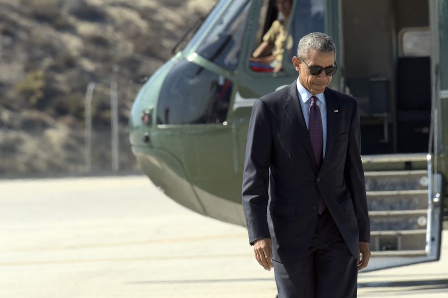 President Barack Obama walks from Marine One toward Air Force One at Los Angeles International Airport, Tuesday, Oct. 25, 2016. Obama is returning to Washington after spending a few days in Nevada and California campaigning for Democratic presidential candidate Hillary Clinton. (AP Photo/Susan Walsh)
