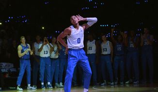 Duke freshman Jayson Tatum acknowledges the crowd during the school&#39;s annual college basketball Countdown to Craziness event Saturday Oct. 22 2016, in Durham, N.C. (Bernard Thomas/The Herald-Sun via AP)