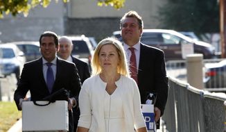 In this Oct. 19, 2016 file photo, Gov. Chris Christie&#39;s former Deputy Chief of Staff, Bridget Kelly, center, arrives at Martin Luther King Jr. Courthouse in Newark, N.J., with her attorneys Michael Critchley Jr., right, and Michael Critchley, back second left. Kelly talked to Christie about the September 2013 Fort Lee lane closures twice while they were underway, including once in which she passed along that the city&#39;s mayor, Mark Sokolich, had asked whether the lanes were closed for &amp;quot;government retribution.&amp;quot; (AP Photo/Mel Evans, File)