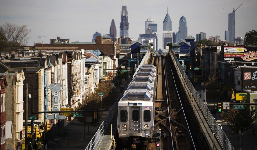 A train moves along the Market-Frankford Line in Philadelphia, Wednesday, Oct. 26, 2016. (AP Photo/Matt Rourke)