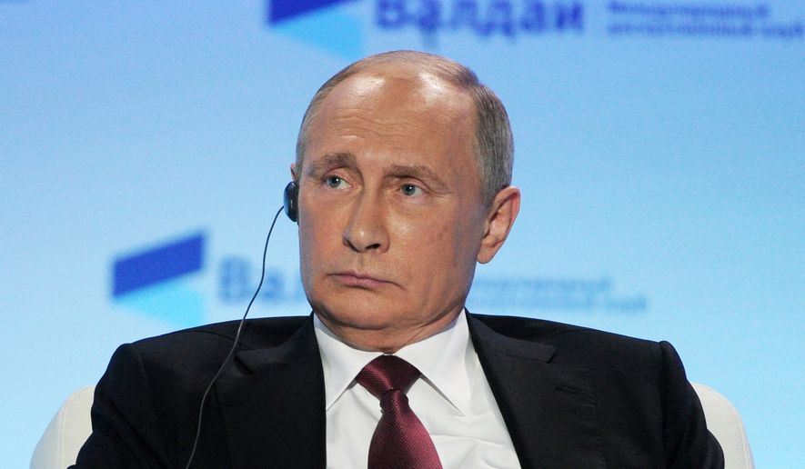 Russian President Vladimir Putin attends a meeting of the Valdai International Discussion Club in Sochi, Russia, Thursday, Oct. 27, 2016. President Vladimir Putin says the claims of Russia&#x27;s interference in the U.S. presidential election are designed to distract public attention from real issues. (Mikhail Klimentyev/Sputnik, Kremlin Pool Photo via AP)