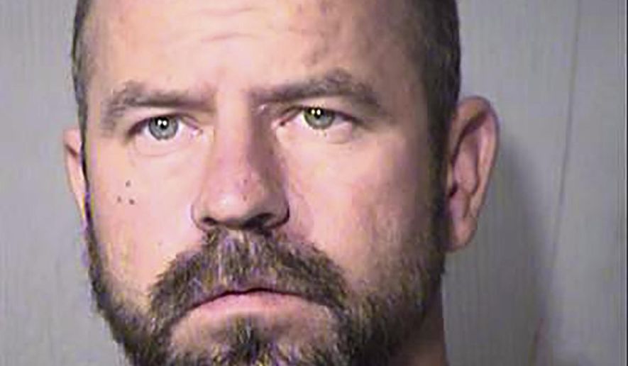 In this Thursday, Oct. 27, 2016 photo released by the Maricopa County Sheriff's Office, shows Joshua Adkins. According to jail records, Adkins was booked on suspicion of unlawful flight from law enforcement, aggravated assault-domestic violence and unlawful imprisonment. (Maricopa County Sheriff's Office via AP)