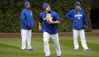 Chicago Cubs&#x27; Kyle Schwarber works out in the outfield during batting practice for Game 3 of the Major League Baseball World Series against the Cleveland Indians, Thursday, Oct. 27, 2016, in Chicago. (AP Photo/Charles Rex Arbogast)