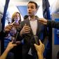 Campaign manager Robby Mook, right, accompanied by Director of Communications Jennifer Palmieri, left, speaks to members of the media aboard Democratic presidential candidate Hillary Clinton&#39;s campaign plane, Friday, Oct. 28, 2016, while traveling to Iowa. (AP Photo/Andrew Harnik) ** FILE **