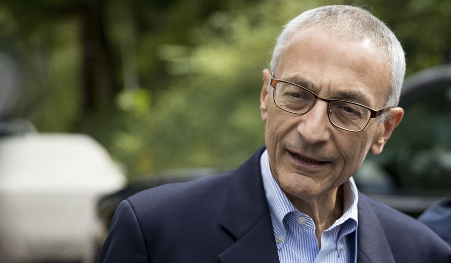 In this Oct. 5, 2016, file photo, Hillary Clinton&#39;s campaign manager John Podesta speaks to members of the media outside Clinton&#39;s home in Washington. (AP Photo/Andrew Harnik, File)