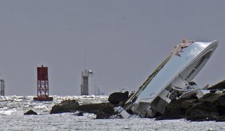 FILE - In this Sept. 25, 2016, file photo, a boat lies overturned on a jetty off Miami Beach, Fla., in a crash that killed Miami Marlins starting pitcher Jose Fernandez and two others. Toxicology reports show Fernandez had cocaine and alcohol in his system when his boat crashed into a Miami Beach jetty. The cause of death was listed as &quot;boat crash&quot; in the autopsy report released Saturday, Oct. 29, 2016, by the Miami-Dade County Medical Examiner&#39;s Office. (Patrick Farrell/Miami Herald via AP, File)