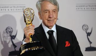 FILE - In this Aug. 21, 2010 file photo, Norman Brokaw poses with the Governor&#39;s Award in the press room at the Creative Arts Emmy Awards in Los Angeles.  Brokaw, who ascended from mailroom at the William Morris Agency to become its CEO and represented top talent such as Marilyn Monroe, Clint Eastwood and Bill Cosby, died on Saturday, Oct. 29, 2016, after a long illness. (AP Photo/Chris Pizzello)