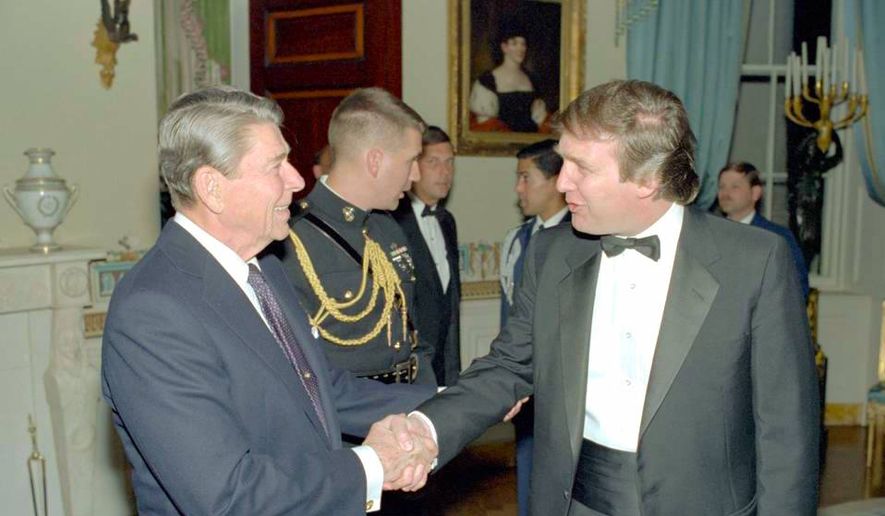 Donald Trump and President Ronald Reagan meet at a 1985 White House reception. (Ronald Reagan Presidential Library) ** FILE **