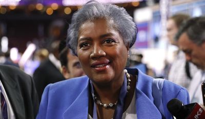 FILE - In this July 25, 2016 file photo, Donna Brazile, interim chair of the Democratic National Committee, appears on the floor of the Democratic National Convention in Philadelphia. CNN says it is &amp;quot;completely uncomfortable&amp;quot; to learn through WikiLeaks that Brazile had contacted the Clinton campaign ahead of time about a question that would be posed during a presidential primary town hall last March in Flint, Mich. CNN announced Monday, Oct. 31, that it had accepted Brazile&#39;s resignation as a contributor two weeks ago. Her deal had been suspended in July when she became interim head of the Democratic National Committee. (AP Photo/Paul Sancya, File)