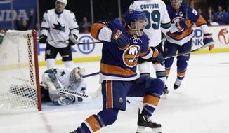 FILE - In this Oct. 18, 2016, file photo, New York Islanders&#39; Anthony Beauvillier (72) celebrates after scoring his first career goal as San Jose Sharks goalie Aaron Dell gets up during the second period of an NHL hockey game in New York.  In the NFL and NBA, when you’re drafted it’s your turn to play, and MLB prospects almost always start in the minors, but NHL teams get the chance to test-run some of their top young prospects. After making their team&#39;s opening night NHL roster, those players are saddled with the uncertainty of another nine-game tryout, and decision time is near on many of them. (AP Photo/Frank Franklin II, File)