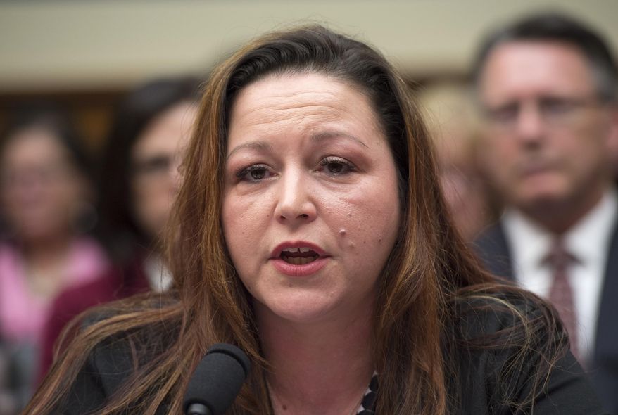 FILE- In a Feb. 3, 2016 file photo, Flint, Mich. resident LeeAnne Walters testifies on Capitol Hill in Washington. Smithsonian magazine announced Monday, Oct. 31, 2016, that the winners of prizes for innovations in art, science and culture include Walters and Marc Edwards, the Virginia Tech professor she recruited to test the water. (AP Photo/Molly Riley, File)