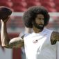 In this photo take Oct. 23, 2016, San Francisco 49ers quarterback Colin Kaepernick warms up before an NFL football game against the Tampa Bay Buccaneers in Santa Clara, Calif. In recent months, Kaepernick has become comfortable with people knowing him as more than a laser-focused football player as he always previously preferred it. Perhaps, through the anthem protest and his emergence as an outspoken activist for minorities, he has improved his image in the process.  (AP Photo/Marcio Jose Sanchez)