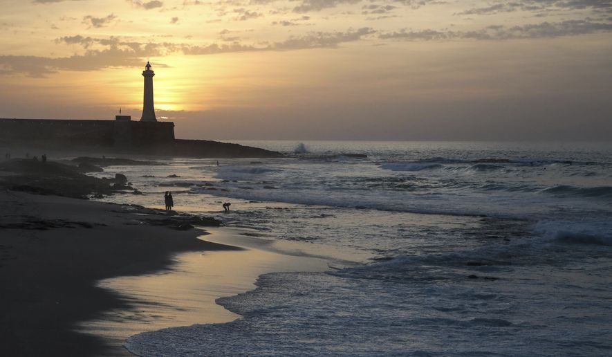 Beachgoers enjoy an evening by the Atlantic ocean on Wednesday, Nov. 2, 2016, in, Rabat, Morocco. Rabat beach is a hub for families, couples and fitness enthusiasts especially on temperate days. (AP Photo/Mosa'ab Elshamy)