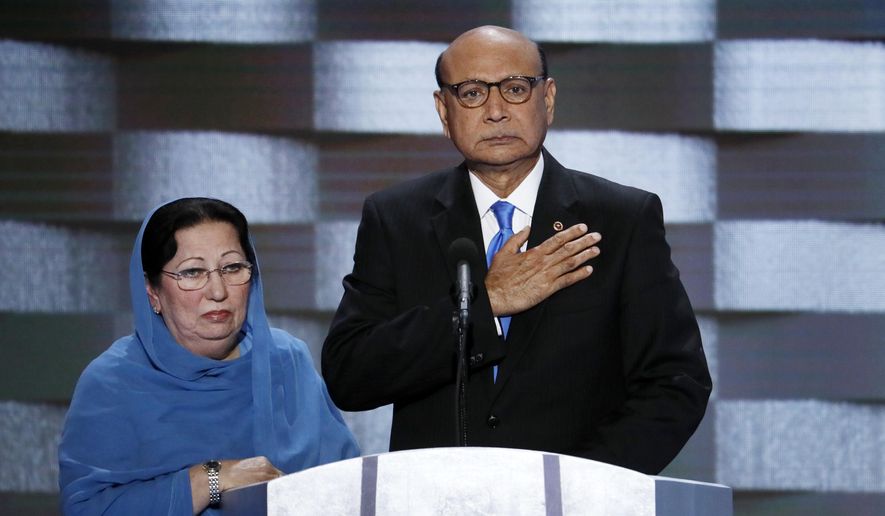 Khizr Khan, father of fallen Army Capt. Humayun Khan and his wife Ghazala, speak during the final day of the Democratic National Convention in Philadelphia, in this July 28, 2016, file photo. (AP Photo/J. Scott Applewhite, File)