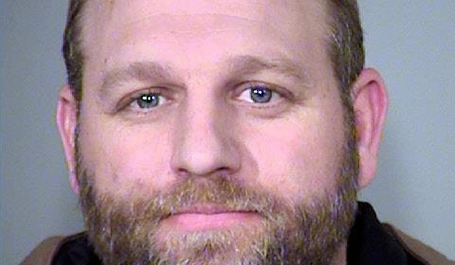 FILE - This Jan. 27, 2016, file photo provided by the Multnomah County Sheriff's Office shows Ammon Bundy. Bundy and his brother, Ryan Bundy, are being transferred from Portland, Ore., jail Wednesday, Nov. 2, 2016, to Nevada where they will be tried early next year on charges stemming from a 2014 standoff with federal agents near their father's ranch. (Multnomah County Sheriff via AP, File)