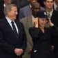 First lady Hillary Rodham Clinton tries on her new New York Yankees hat as she stands next to Yankees owner George Steinbrenner during an event honoring the 1998 World Series champions on the South Lawn of the White House to honor the 1998 World Series Champions, Thursday, June 10, 1999. (AP Photo/Susan Walsh)