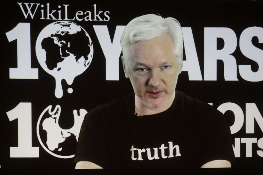 In this Oct. 4, 2016 file photo, WikiLeaks founder Julian Assange participates via video link at a news conference marking the 10th anniversary of the secrecy-spilling group in Berlin, Germany. (AP Photo/Markus Schreiber, File)
