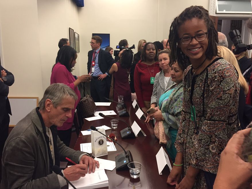 Kendall Clark, a sophomore at the Park School of Baltimore, gets an autograph from Oscar-winning actor Jeremy Irons at a White House panel on STEM (science, technology, engineering, mathematics) studies on Oct. 28. Kendall is one of the first students selected for the Spirit of Ramanujan Initiative, a global mentoring program for young mathematicians. Mr. Irons stars in a new film about Srinivasa Ramanujan, titled "The Man Who Knew Infinity." Photo by Julia Porterfield / The Washington Times