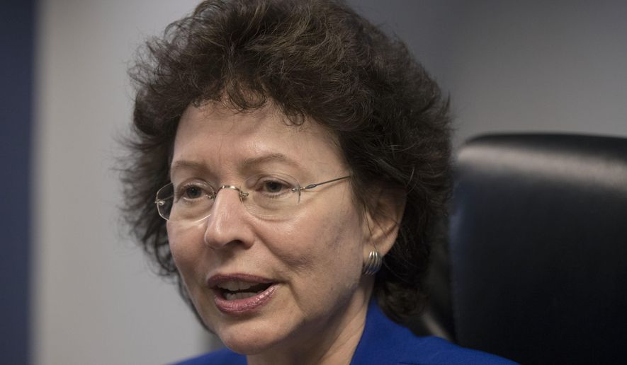 In this Thursday, Oct. 27, 2016 photo, Big Brothers Big Sisters President Pam Iorio speaks during an interview with The Associated Press. One of the country's oldest mentoring organizations is launching a program pairing officers with youth in an effort to address the fraught relationship between police and the communities they serve. (AP Photo/Matt Rourke)