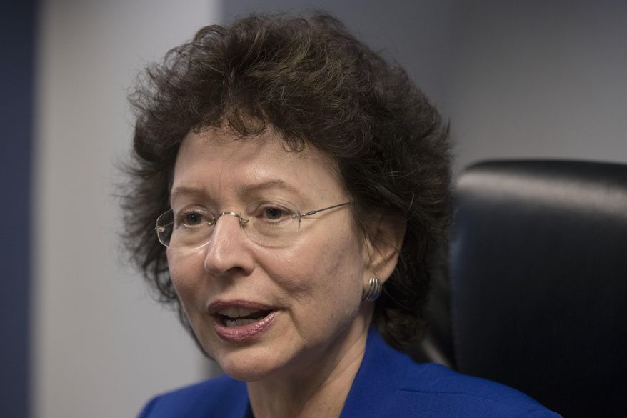 In this Thursday, Oct. 27, 2016 photo, Big Brothers Big Sisters President Pam Iorio speaks during an interview with The Associated Press. One of the country's oldest mentoring organizations is launching a program pairing officers with youth in an effort to address the fraught relationship between police and the communities they serve. (AP Photo/Matt Rourke)