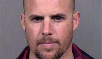 FILE - This Jan. 27, 2016, file photo, provided by the Maricopa County Sheriff&#39;s Office shows Jon Ritzheimer, who was arrested in Arizona on Jan. 26, 2016, in connection with the occupation of the Malheur National Wildlife Refuge in Oregon. Ritzheimer, who pleaded guilty to conspiracy as part of a plea bargain, the same charge that a just acquitted seven other occupiers were acquitted of last week, says his lawyer is talking with prosecutors about withdrawing his guilty plea as a possible future option. (Maricopa County Sheriffs Office via AP, file)