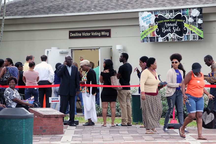 Voters stand in line outside the North Miami Public Library waiting to cast ballots during early voting, Friday, Nov. 4, 2016, in North Miami, Fla. (Roberto Koltun/Miami Herald via AP) ** FILE **