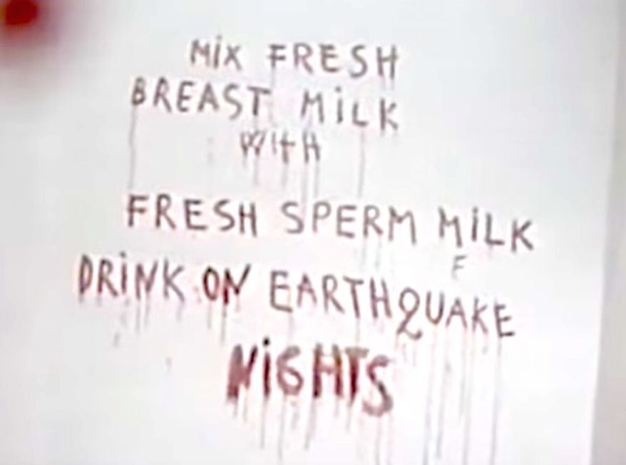 A YouTube video uploaded in March 2009 shows artist Marina Abramovic paint "Spirit Cooking" details on a wall in Italy, June 1997. (YouTube radioartmobile screenshot)