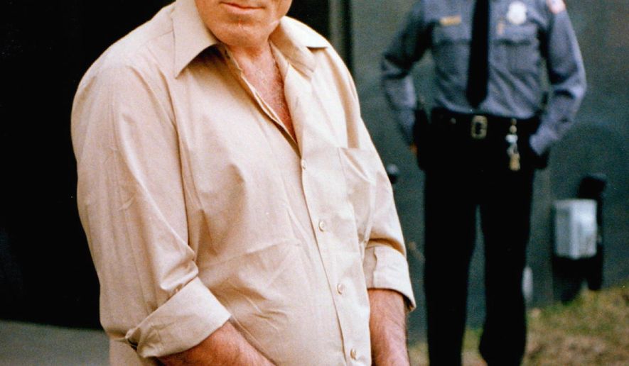FILE - In this April 1, 1988 file photo, Billy Glaze, who was convicted of killing three women in Minneapolis in the 1980s, walks out of the federal building in Minneapolis. A Hennepin County judge has ruled that Glaze's appeal for innocence died with him in prison in 2015. Glaze long maintained his innocence. At the time of his death, attorneys with the Minnesota Innocence Project were trying to free him based on new DNA evidence allegedly pointing to another man. (Bruce Bisping/Star Tribune via AP, File) /Star Tribune via AP)