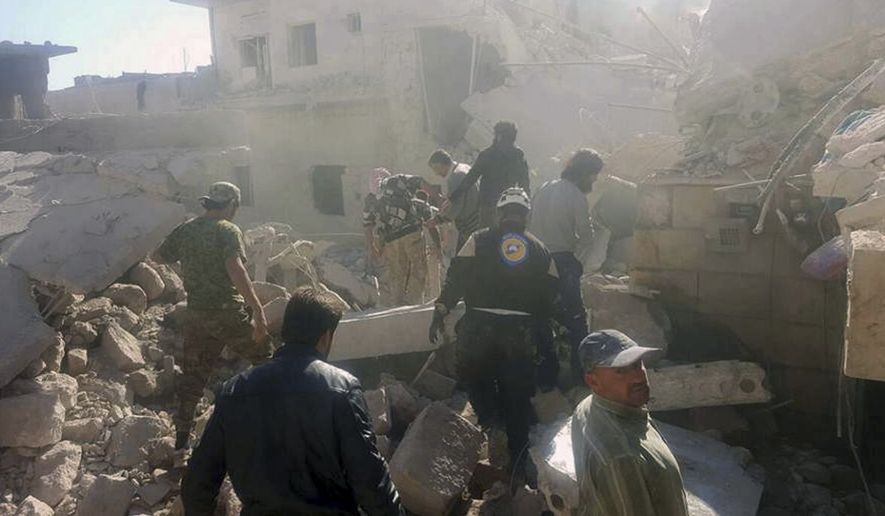 This photo provided by the Syrian Civil Defense White Helmets, which has been authenticated based on its contents and other AP reporting, shows Civil Defense workers and Syrian citizens inspecting damaged buildings after airstrikes hit in Darat Izza town, in rural western Aleppo province, Syria, Saturday, Nov. 5, 2016. (Syrian Civil Defense White Helmets via AP) ** FILE **