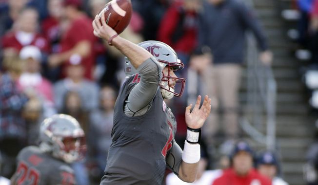 Washington State quarterback Luke Falk passes the ball during the first half of an NCAA college football game against Arizona in Pullman, Wash., Saturday, Nov. 5, 2016. (AP Photo/Young Kwak)