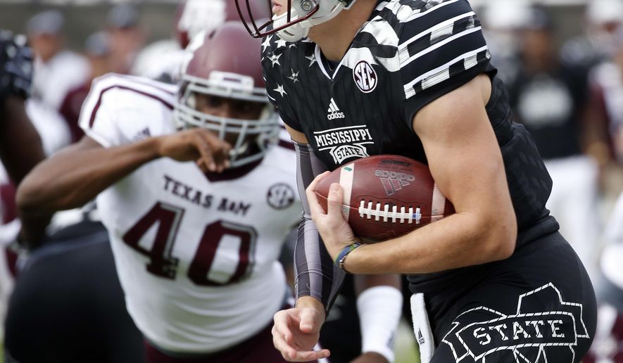 Mississippi State quarterback Nick Fitzgerald (7) runs past a Texas A&amp;amp;M defender for a 74-yard touchdown run in the first half of a NCAA college football game in Starkville, Miss., Saturday, Nov. 5, 2016. (AP Photo/Rogelio V. Solis)