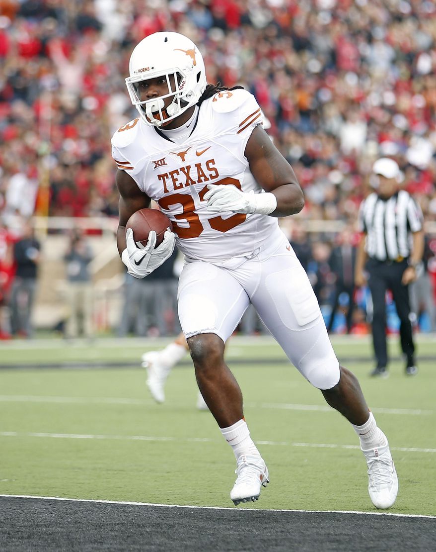 Texas' D'Onta Foreman (33) runs the ball into the end zone during an NCAA college football game against Texas Tech, Saturday, Nov. 5, 2016, in Lubbock, Texas. (Brad Tollefson/Lubbock Avalanche-Journal via AP)
