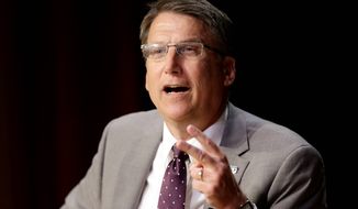 North Carolina Gov. Pat McCrory has taken a beating from critics over a law dictating which restrooms transgender people can use, pointing it its economic harm and the declining reputation of the state. (Associated Press)