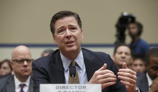 In this July 7, 2016, file photo, FBI Director James B. Comey testifies on Capitol Hill in Washington before the House Oversight Committee to explain his agency&#39;s recommendation to not prosecute Hillary Clinton. In a letter from Comey released on Nov. 6, he tells Congress review of additional Clinton emails does not change conclusion she should not face charges. (AP Photo/J. Scott Applewhite, File)