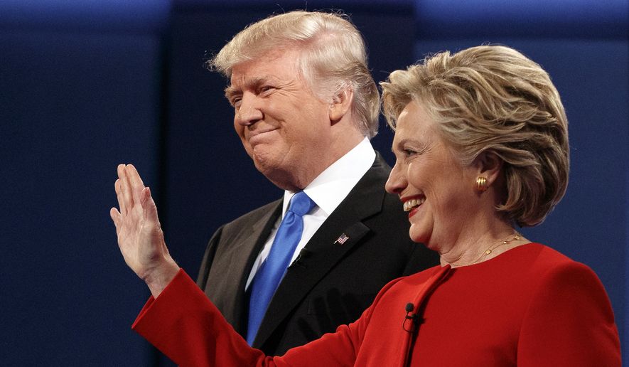 Donald Trump stands with Hillary Clinton at the first presidential debate on Sept. 26, 2016, at Hofstra University in Hempstead, New York. (Associated Press) **FILE**