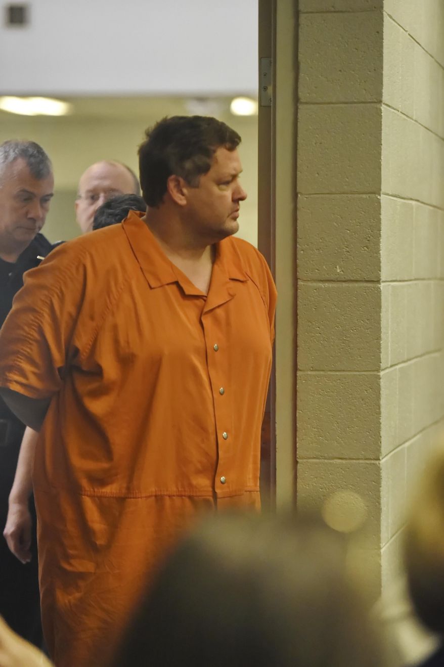 Todd Kohlhepp's enters the courtroom of Judge Jimmy Henson for a bond hearing at the Spartanburg Detention Facility, in Spartanburg, S.C. Sunday, Nov. 6, 2016. The judge denied bond for Kohlhepp, charged with a 2003 quadruple slaying and more recently holding a woman captive on his property. (AP Photo/Richard Shiro)