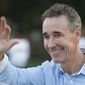 In this Wednesday, Nov. 2, 2016 photo, Richmond, Va., mayoral candidate Joe Morrissey waves to supporters as he campaigns on a busy street corner in Richmond, Va. Morrissey faces five other candidates. On Friday, Nov. 4, 2016, the Henrico County Commonwealth&#39;s Attorney said Morrissey won&#39;t face criminal charges following allegations he pressured a legal client for sex. (AP Photo/Steve Helber)