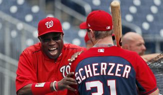 Washington Nationals manager Dusty Baker and starting pitcher Max Scherzer share a laugh during baseball batting practice at Nationals Park, Thursday, Oct. 6, 2016, in Washington. The Nationals host the Los Angeles Dodgers in Game 1 of the National League Division Series on Friday. (AP Photo/Alex Brandon) **FILE**

