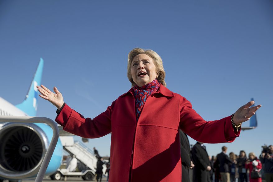 Democratic presidential candidate Hillary Clinton speaks to members of the media before boarding her campaign plane at Westchester County Airport in White Plains, N.Y., Monday, Nov. 7, 2016, to travel to Pittsburgh. (AP Photo/Andrew Harnik)