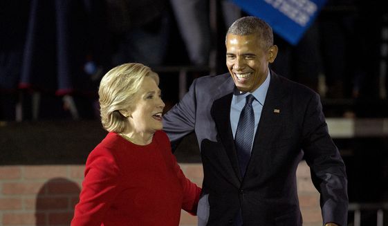 President Barack Obama and Democratic presidential candidate Hillary Clinton walk off stage after both spoke at a rally at Independence Mall in Philadelphia. Monday, Nov. 7, 2016. (AP Photo/Pablo Martinez Monsivais) ** FILE **