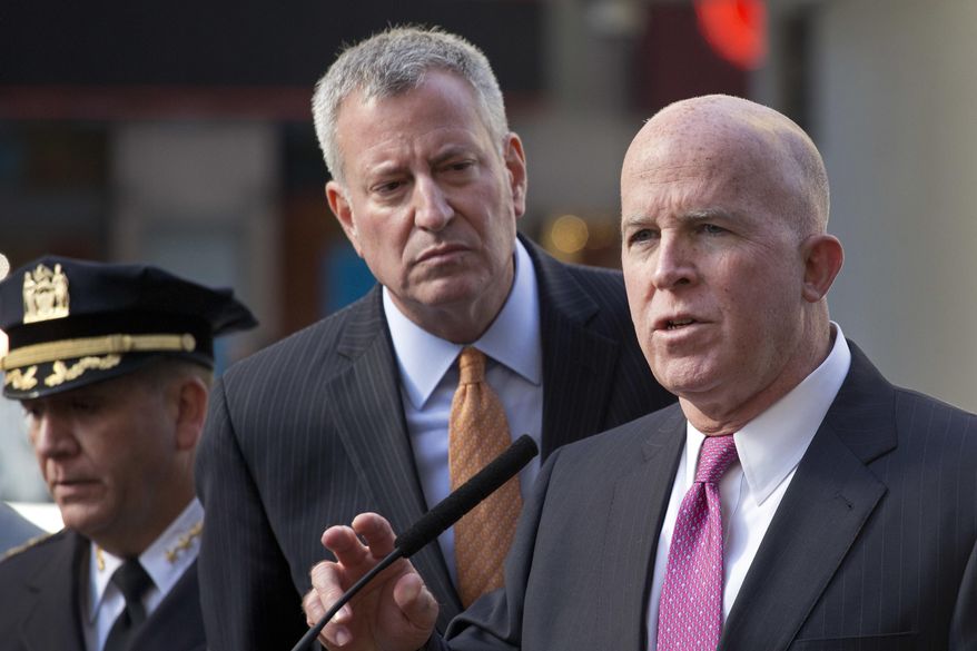 New York Police Department Commissioner James O'Neill, right, gives a security briefing with Mayor Bill de Blasio in advance of Tuesday's election, in New York's Times Square, Monday, Nov. 7, 2016. At left, is Chief of Patrol Carlos Gomez. (AP Photo/Mark Lennihan)