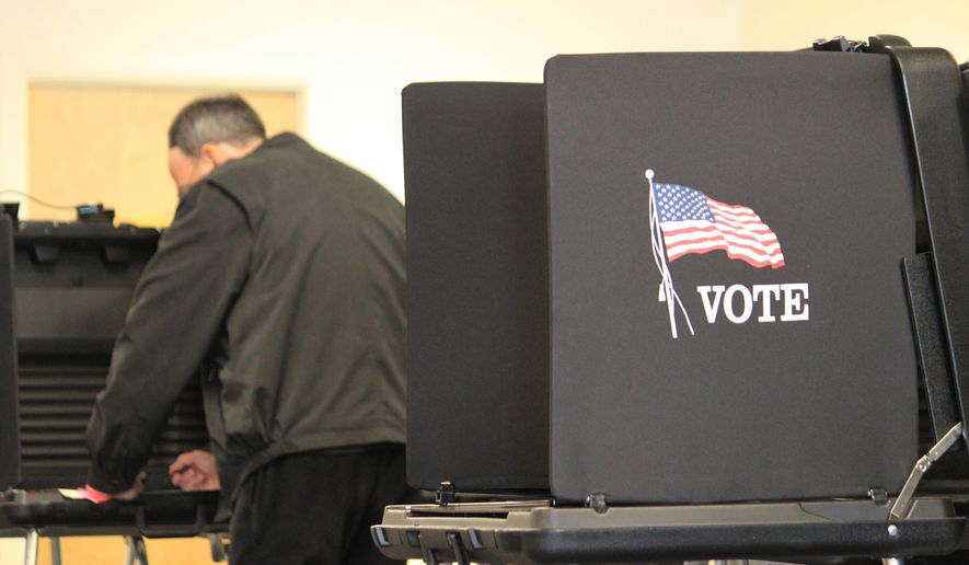 A voter casts a ballot at an early voting site in Albuquerque, N.M., on Thursday, Nov. 3, 2016. Bernalillo County poll workers say there has been a steady stream of voters casting ballots in the final week and crowds are expected Saturday, Nov. 5, the last day of election officials say Clerk Maggie Toulouse Oliver says more than one-third of the county's registered voters have already cast ballots and she expects turnout to reach 2008 levels when 70 percent of voters in the state's most populous county went to the polls. (AP Photo/Susan Montoya Bryan)