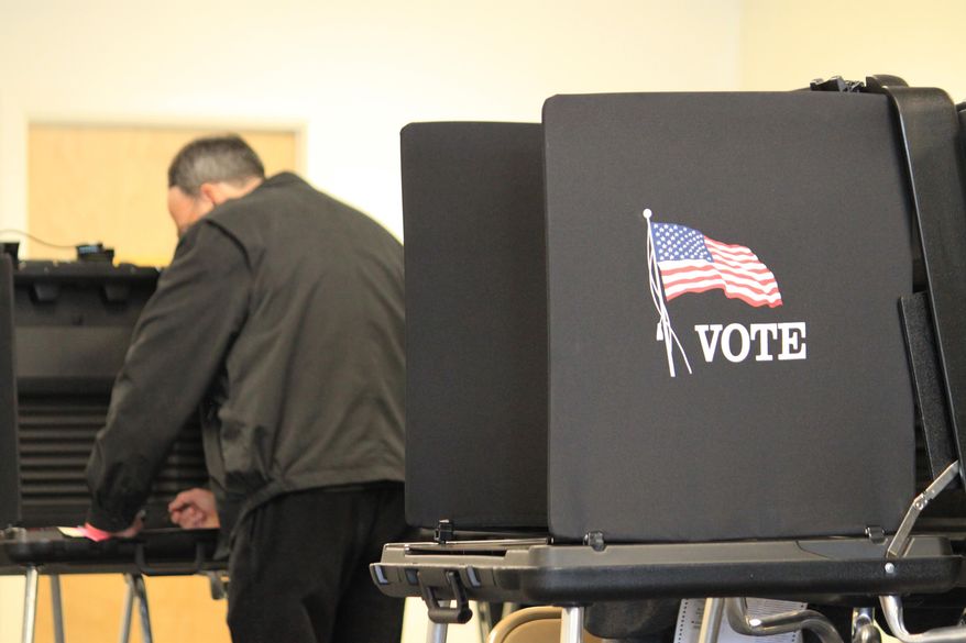 A voter casts a ballot at an early voting site in Albuquerque, N.M., on Thursday, Nov. 3, 2016. Bernalillo County poll workers say there has been a steady stream of voters casting ballots in the final week and crowds are expected Saturday, Nov. 5, the last day of election officials say Clerk Maggie Toulouse Oliver says more than one-third of the county's registered voters have already cast ballots and she expects turnout to reach 2008 levels when 70 percent of voters in the state's most populous county went to the polls. (AP Photo/Susan Montoya Bryan)
