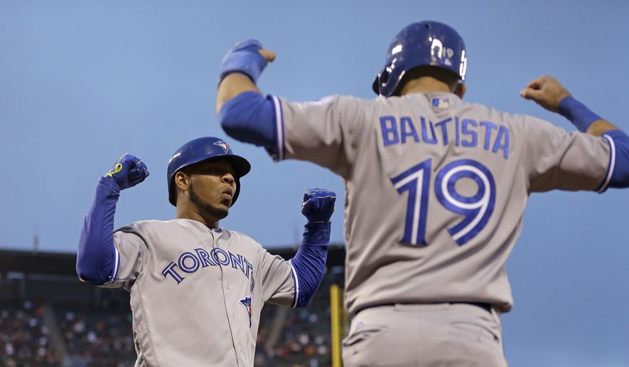 FILE -  This May 9, 2016 file photo shows Toronto Blue Jays&#39; Edwin Encarnacion, left, celebrating with Jose Bautista (19) after hitting a two run home run off San Francisco Giants&#39; Jake Peavy in the third inning of a baseball game in San Francisco. Bautista and Encarnacion were among 10 players to receive $17.2 million qualifying offers from their teams Monday, Nov. 7, 2016 as general managers gathered for their annual meeting. (AP Photo/Ben Margot, file)