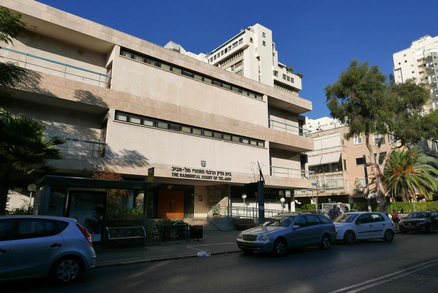 The headquarters of the chief rabbinate in Tel Aviv, Israel, Nov. 5, 2016. The rabbinate is a state-sanctioned institution that controls all matter of marriage and divorce in Israel. An American citizen has been holed up in a Jerusalem apartment for more than a year, unable to return to his home in the U.S. after an Israeli rabbinical court confiscated his passport and banned him from traveling, claiming he’s the reason his son won’t grant a divorce to his estranged wife for my than a decade. (AP Photo/Dan Perry)