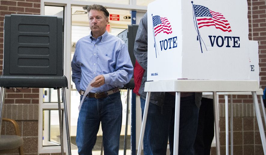 Sen. Rand Paul, R-Ky. casts his vote at Briarwood Elementary School in Bowling Green, Ky., Tuesday, Nov. 8, 2016. (AP Photo/Michael Noble Jr.)