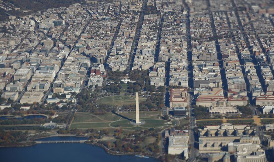 The White House, Washington Monument and greater Washington DC metropolitan area are seen from Air Force One, with President Barack Obama aboard, Monday, Nov. 7, 2016. Obama is dashing across the country on the final day of the 2016 campaign in a final push for Democratic presidential candidate Hillary Clinton. (AP Photo/Pablo Martinez Monsivais)