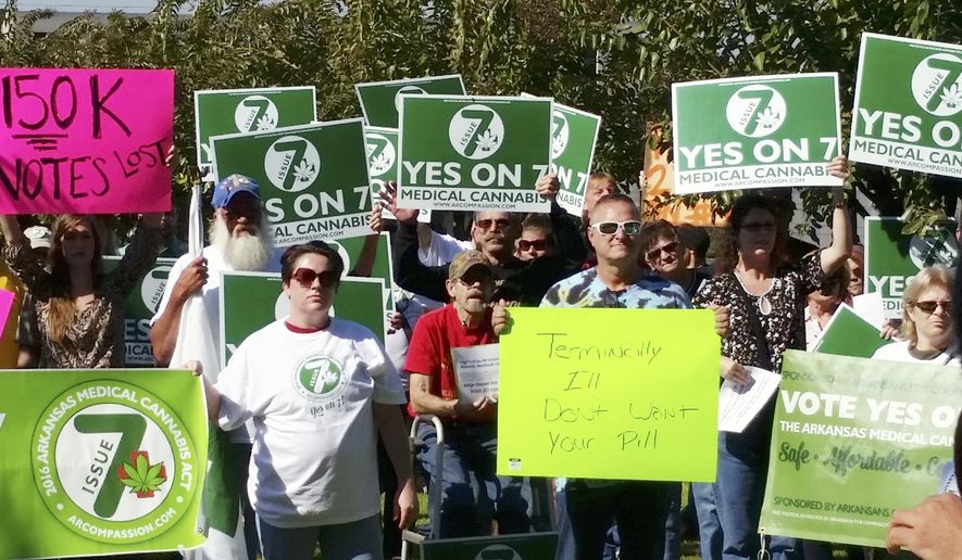 In this Oct. 28, 2016, file photo, supporters of Arkansas Issue 7, a medical marijuana initiative that would have allowed patients with certain conditions an opportunity to obtain or grow marijuana to ease their symptoms, rally outside the Arkansas Supreme Court building in Little Rock. Arkansas could become the first state in the South to legalize medical marijuana, as pot advocates look to the state in the Tuesday, Nov. 8, election to prove that support for the drug is strong even in deeply conservative states. (AP Photo/Kelly P. Kissel, File)