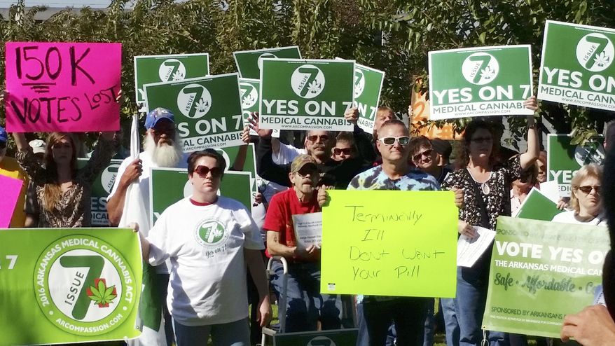 In this Oct. 28, 2016, file photo, supporters of Arkansas Issue 7, a medical marijuana initiative that would have allowed patients with certain conditions an opportunity to obtain or grow marijuana to ease their symptoms, rally outside the Arkansas Supreme Court building in Little Rock. Arkansas could become the first state in the South to legalize medical marijuana, as pot advocates look to the state in the Tuesday, Nov. 8, election to prove that support for the drug is strong even in deeply conservative states. (AP Photo/Kelly P. Kissel, File)